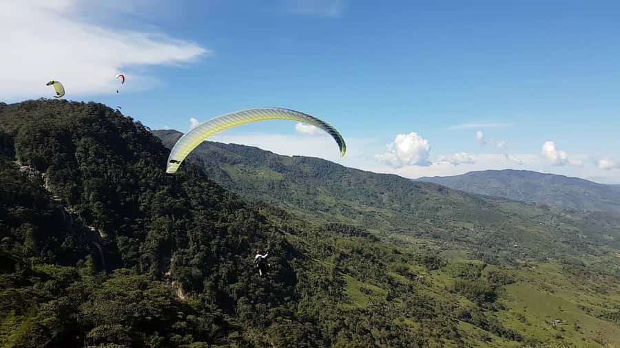 From Medellin: Private Paragliding Tour Over Waterfalls - From Medellin to the Cocorna Canyons