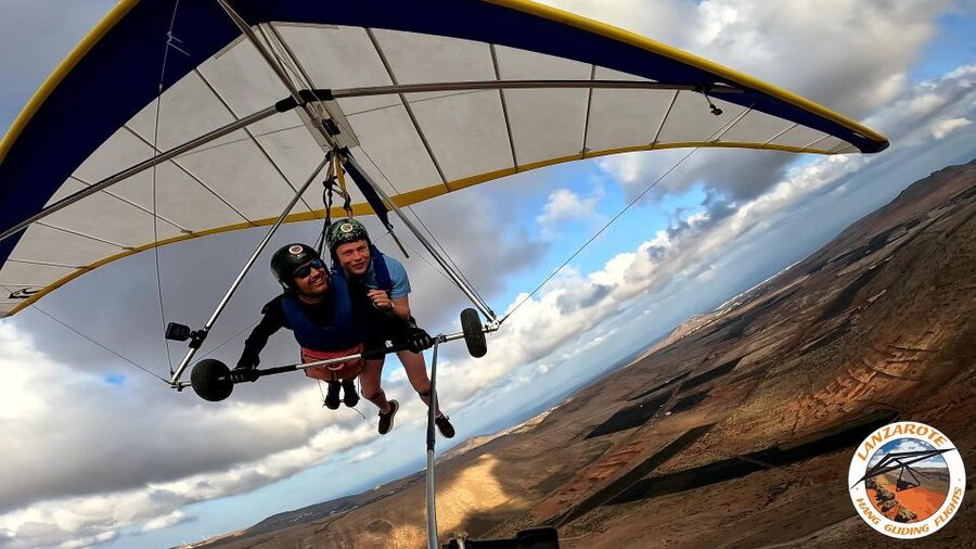 Lanzarote Hang Gliding Tandem Flights - Volcanoes, lava fields, and beaches below