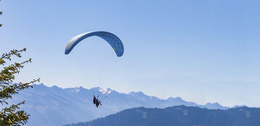 Mayrhofen: Paragliding Flight Experience Over Mountains - Getting fitted with a harness and helmet