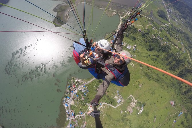 Paragliding - Flying above Pokhara, with the lake below