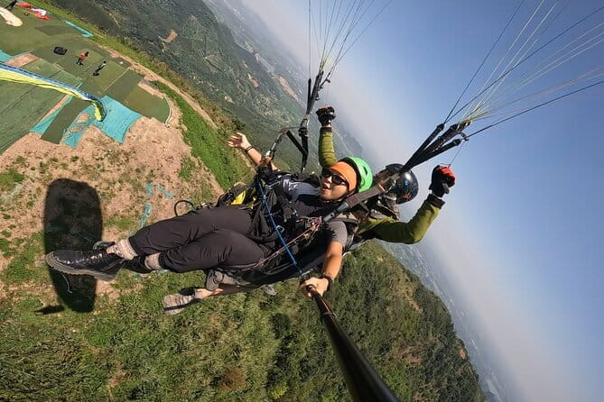 Tandem Paragliding Experience in Hanoi - Booking, weather, and cancellation